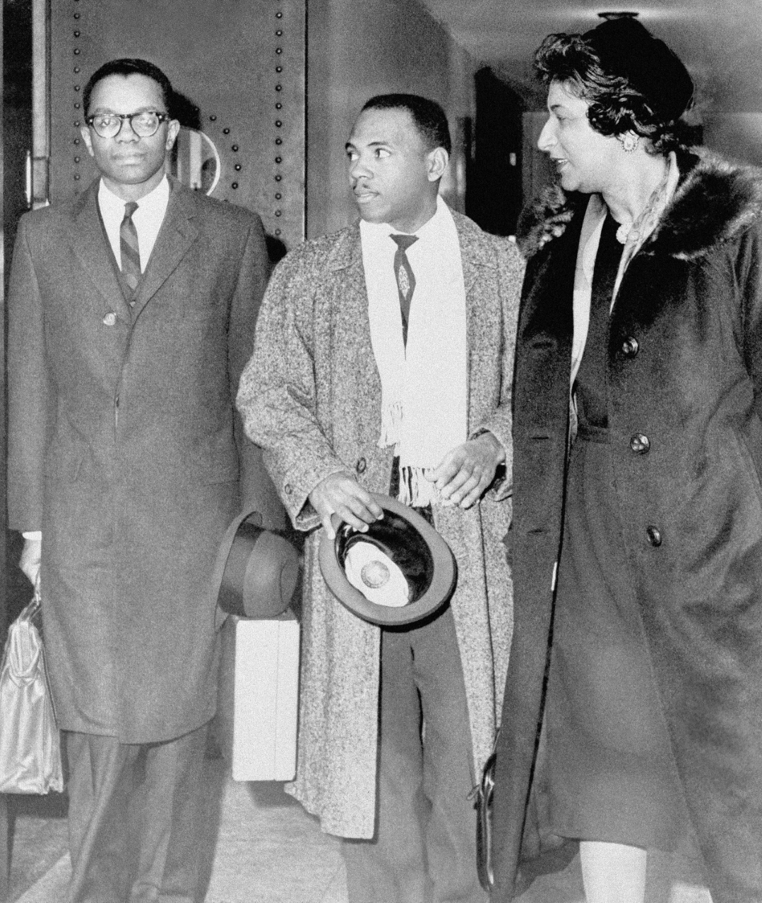 James Meredith, center, an Air Force veteran suing the State of Mississippi for admission to the all-white University of Mississippi, leaves federal court in Jackson, Miss., in this Jan. 16, 1962, file photo, for a noon break with attorneys Derrick Bell, left, and Constance Baker Motley, both of New York. (AP/File Photo)