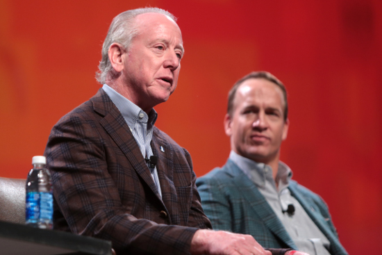 Photograph of Archie Manning and Peyton Manning speaking at an event in Phoenix, Arizona.