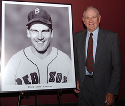 Ferriss with a photograph from his early career