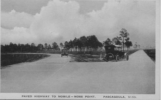 Automobiles travel on concrete highway, circa 1925