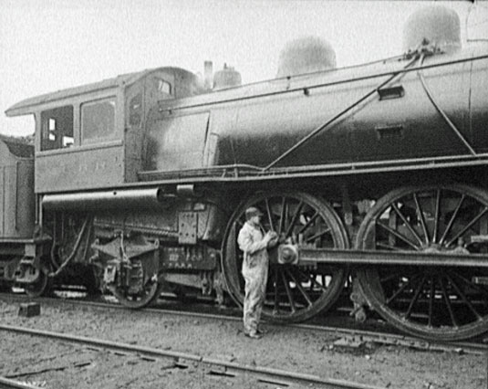 Railroad employee oils wheels 